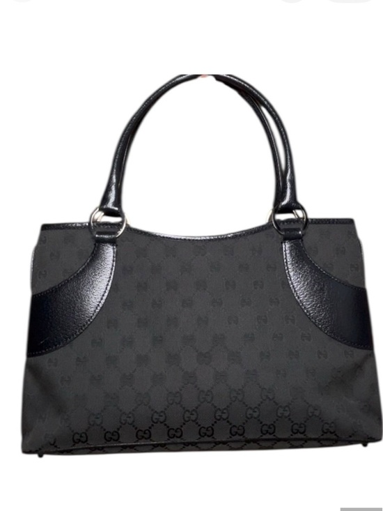 Gucci Handbags - Gucci black GG canvas tote featuring tonal black leather trim
